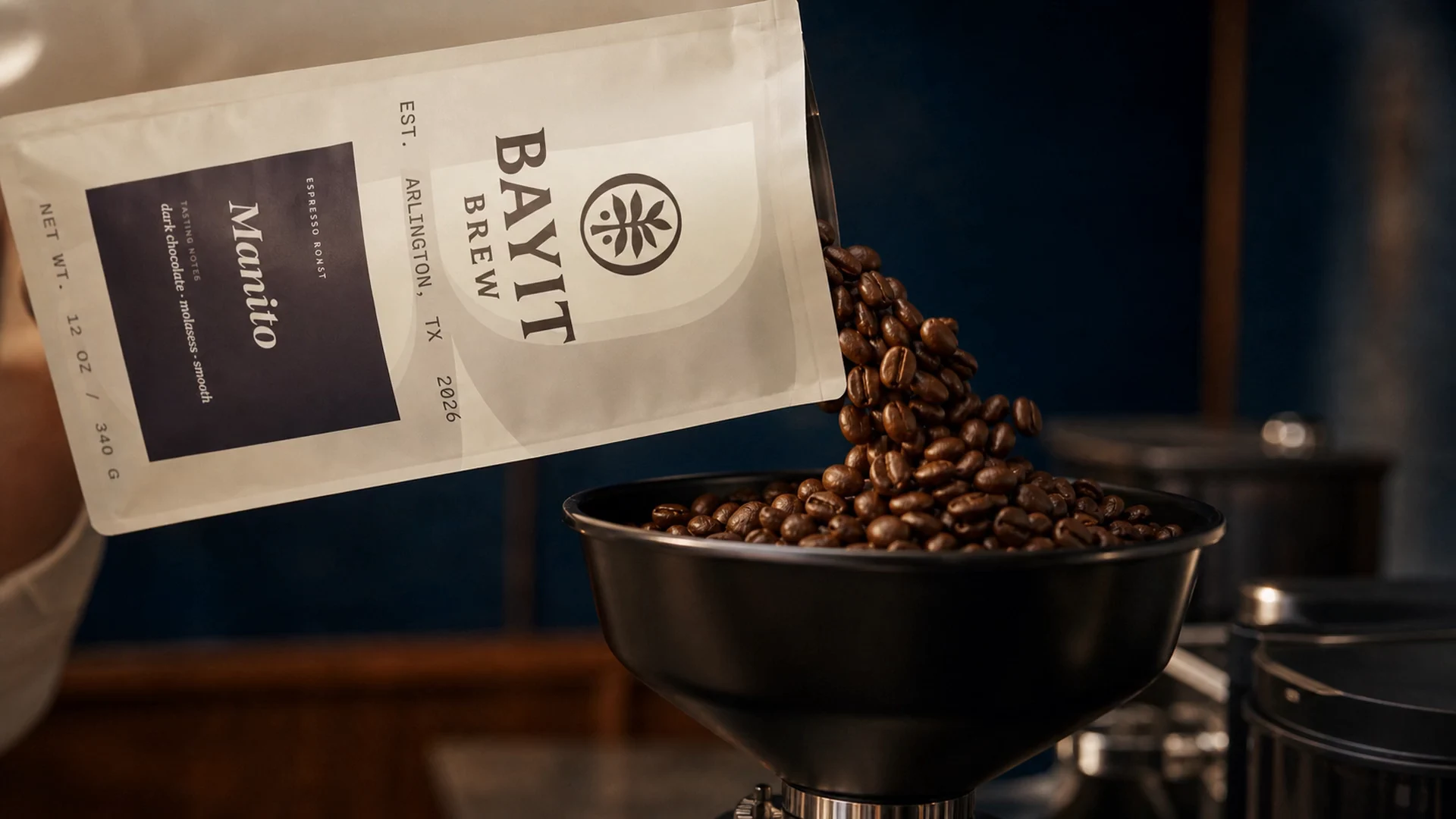 Coffee beans moving through a grinder.